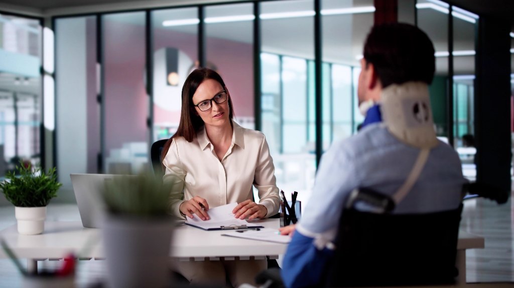 Attorney discussing an Illinois government personal injury claim with an injured client.